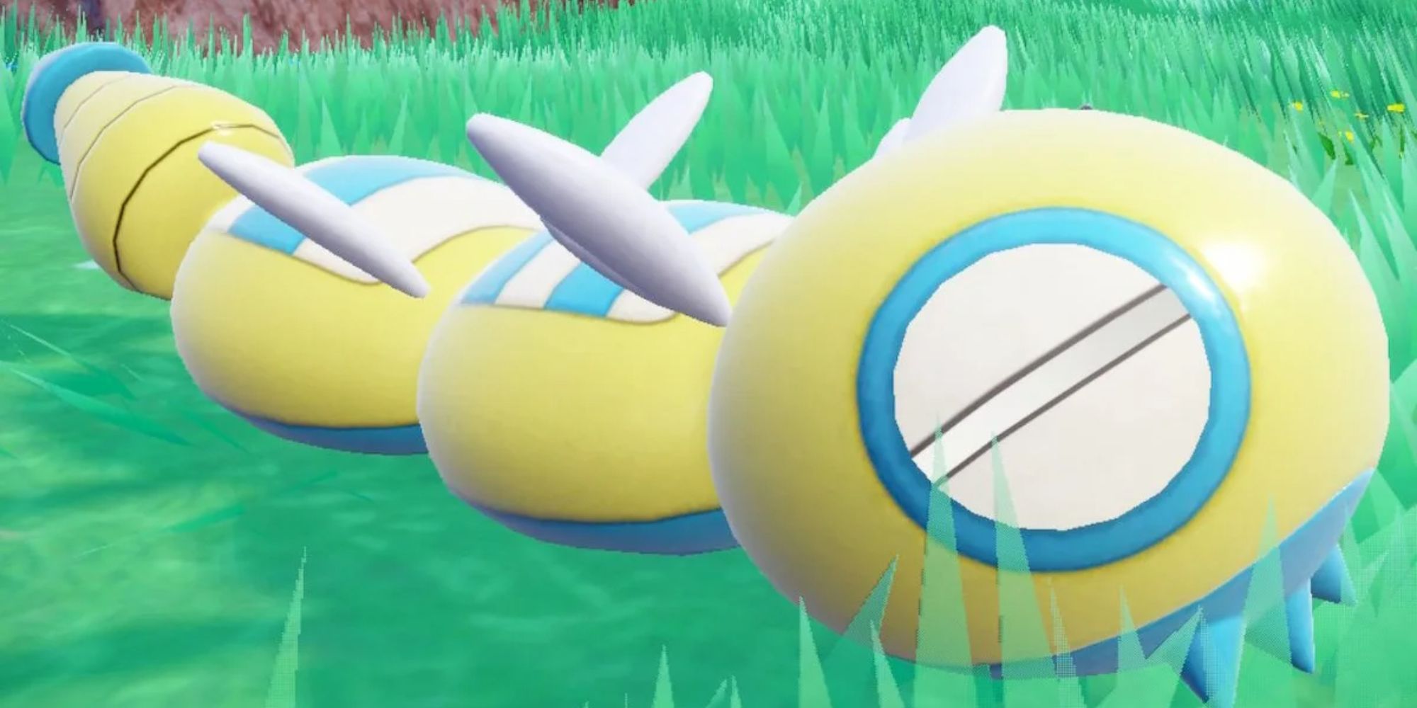 Dudunsparce sitting in grass in Pokemon Scarlet and Violet
