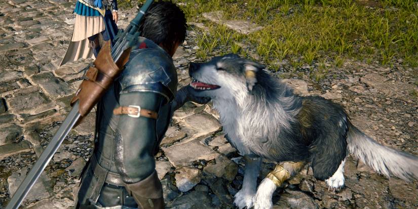 A screenshot from Final Fantasy 16, featuring Clive petting a dog.
