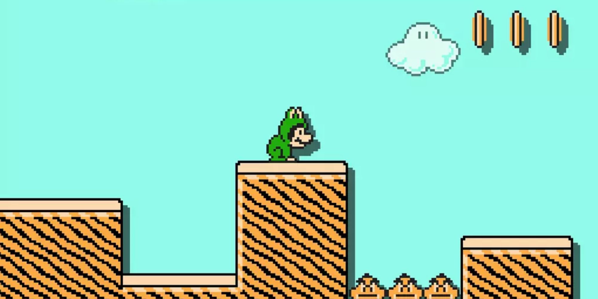 Frog Mario crouching in front of a Goomba pit