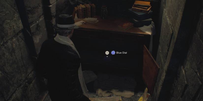Leon finds the Blue Dial in Resident Evil 4 Remake