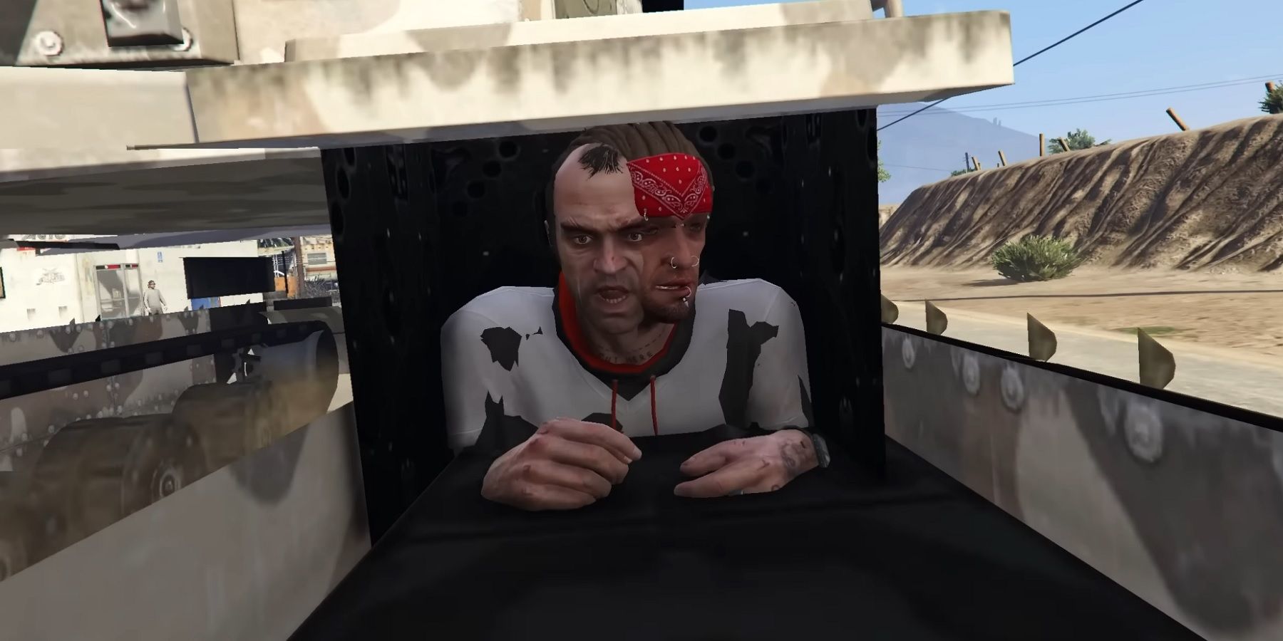 Glitched image from Grand Theft Auto 5 showing Trevor's head mixed in with the head of someone else.