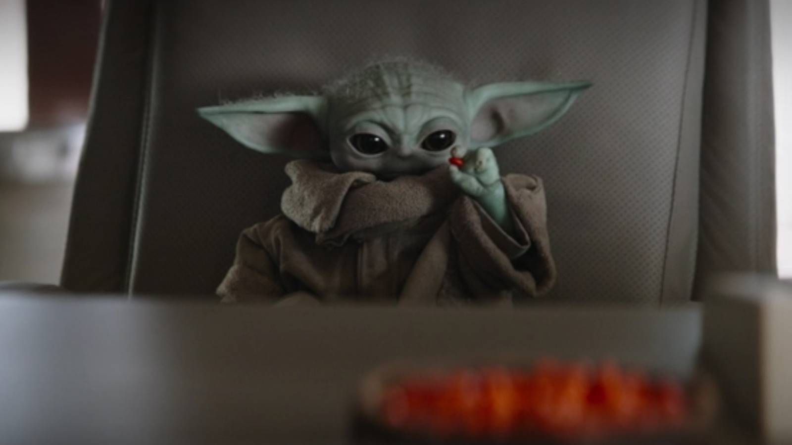 Grogu using the force to catch candy in The Mandalorian