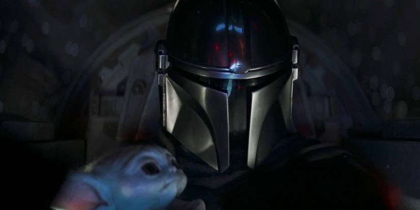 grogu looking at the mandalorian