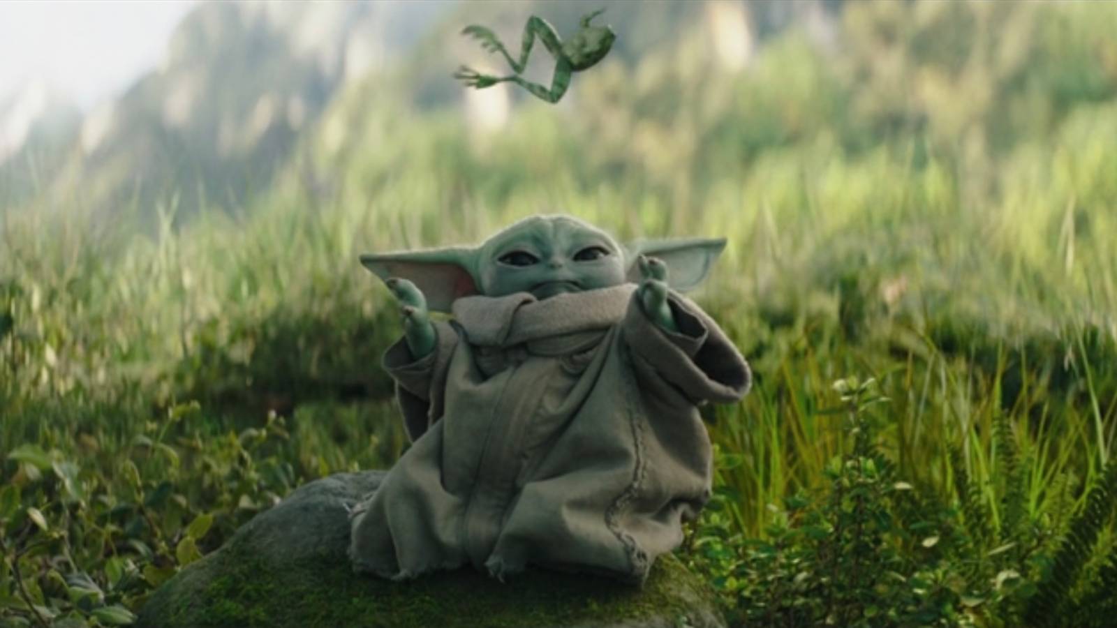 The Mandalorian Grogu Baby Yoda using force in grass field in The Book of Boba Fett