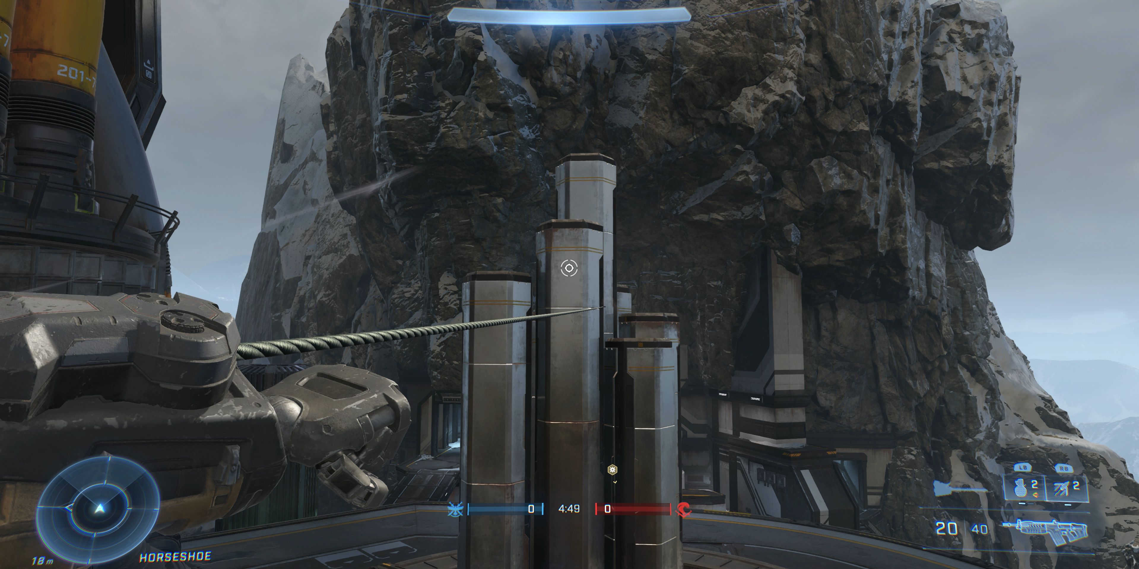 Player using the Grappleshot on Halo Infinite's Cliffhanger map