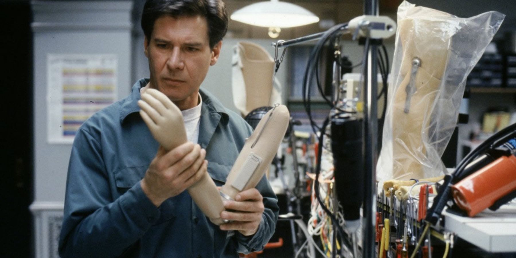 Harrison-Ford-as-Richard-Kimble-analyzing-prosthetic-arm-in-The-Fugitive