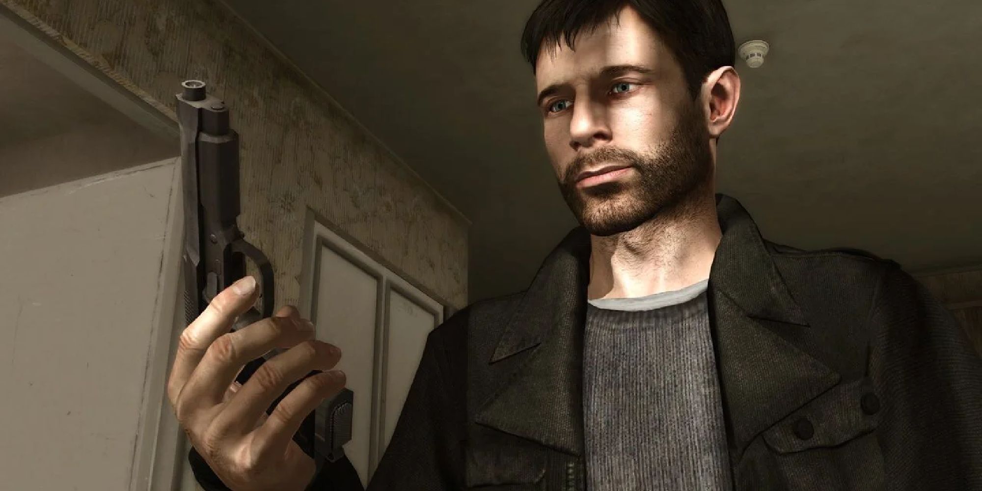 Ethan from Heavy Rain looks at the handgun he holds. 