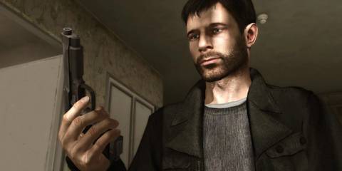 Ethan from Heavy Rain looks at the handgun he holds. 