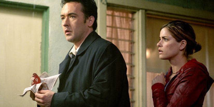 John Cusack and Amanda Peet in Identity