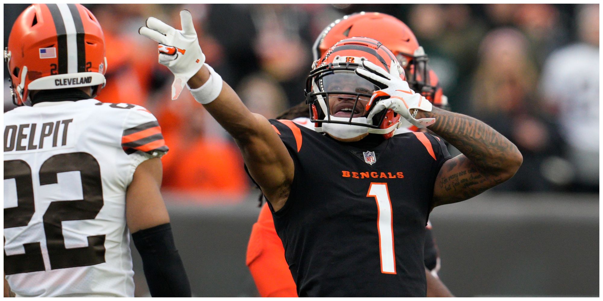 Ja'Marr Chase from NFL team the Cincinnati Bengals posing in the team's black and orange uniform 