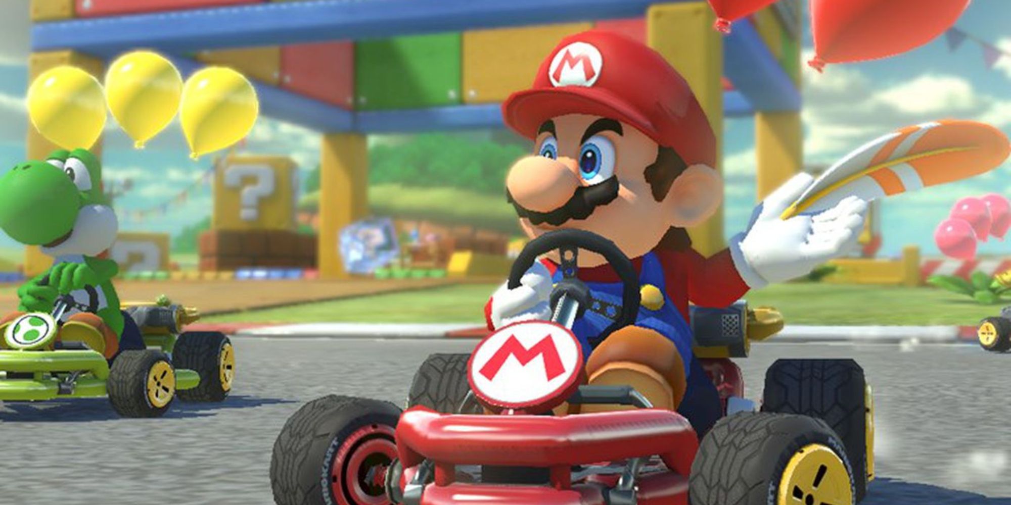 Mario and Yoshi racing in karts with balloons