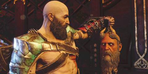 Kratos holding Mimir's head in God Of War: Ragnarok