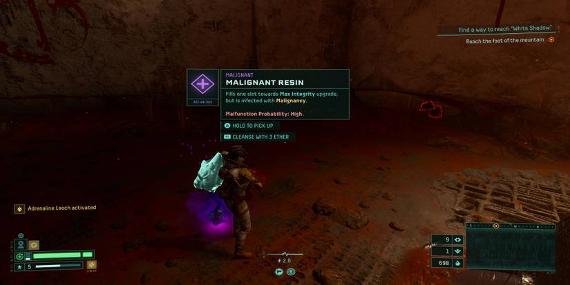 Selene standing next to a Malignant Resin in Returnal.