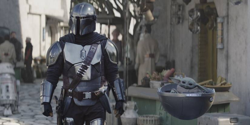 Mando_walking_through_town_with_Grogu_in_The_Mandalorian_season_3