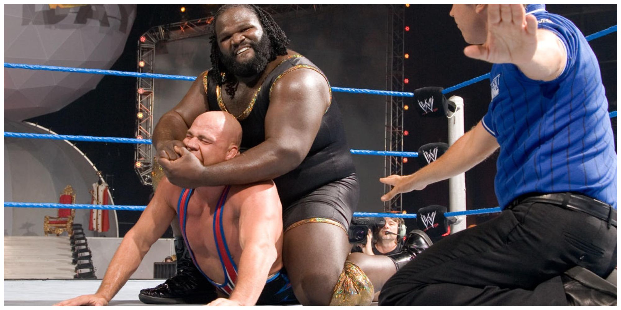 Mark Henry putting Kurt Angle in a submission hold on WWE SmackDown