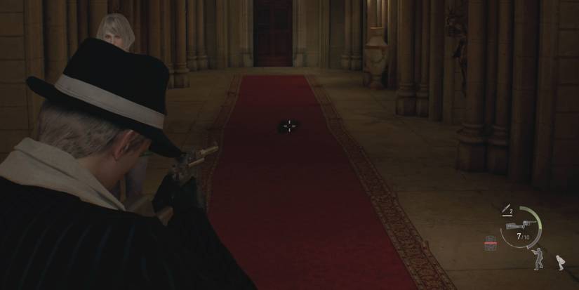 Leon aims at a rat in Resident Evil 4 Remake