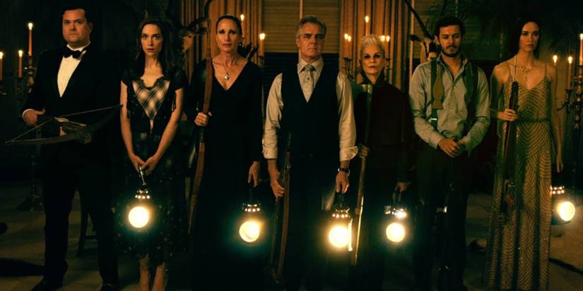 The Le Domas family standing holding lights in Ready Or Not