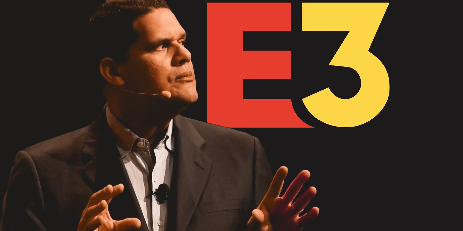 Reggie Fils-Aime in front of E3 logo