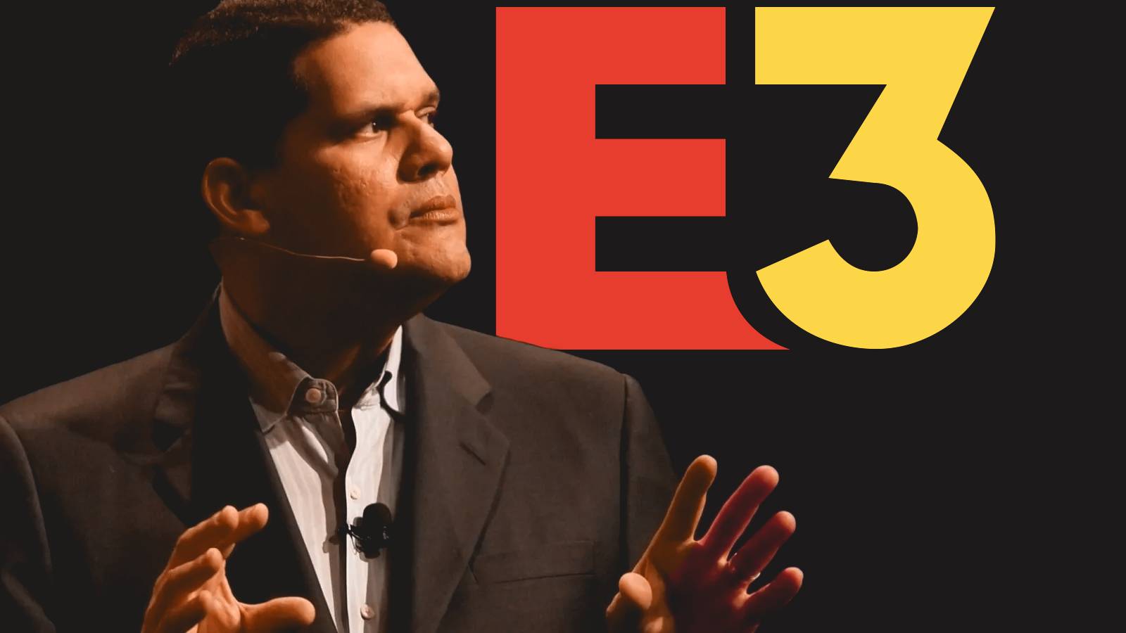 Reggie Fils-Aime in front of E3 logo