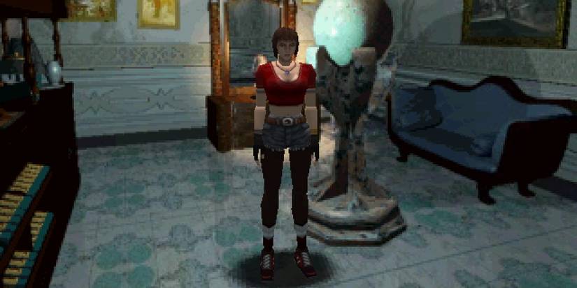 Jill in one of the rooms in the Spencer mansion decked out in a crop top and shorts. 