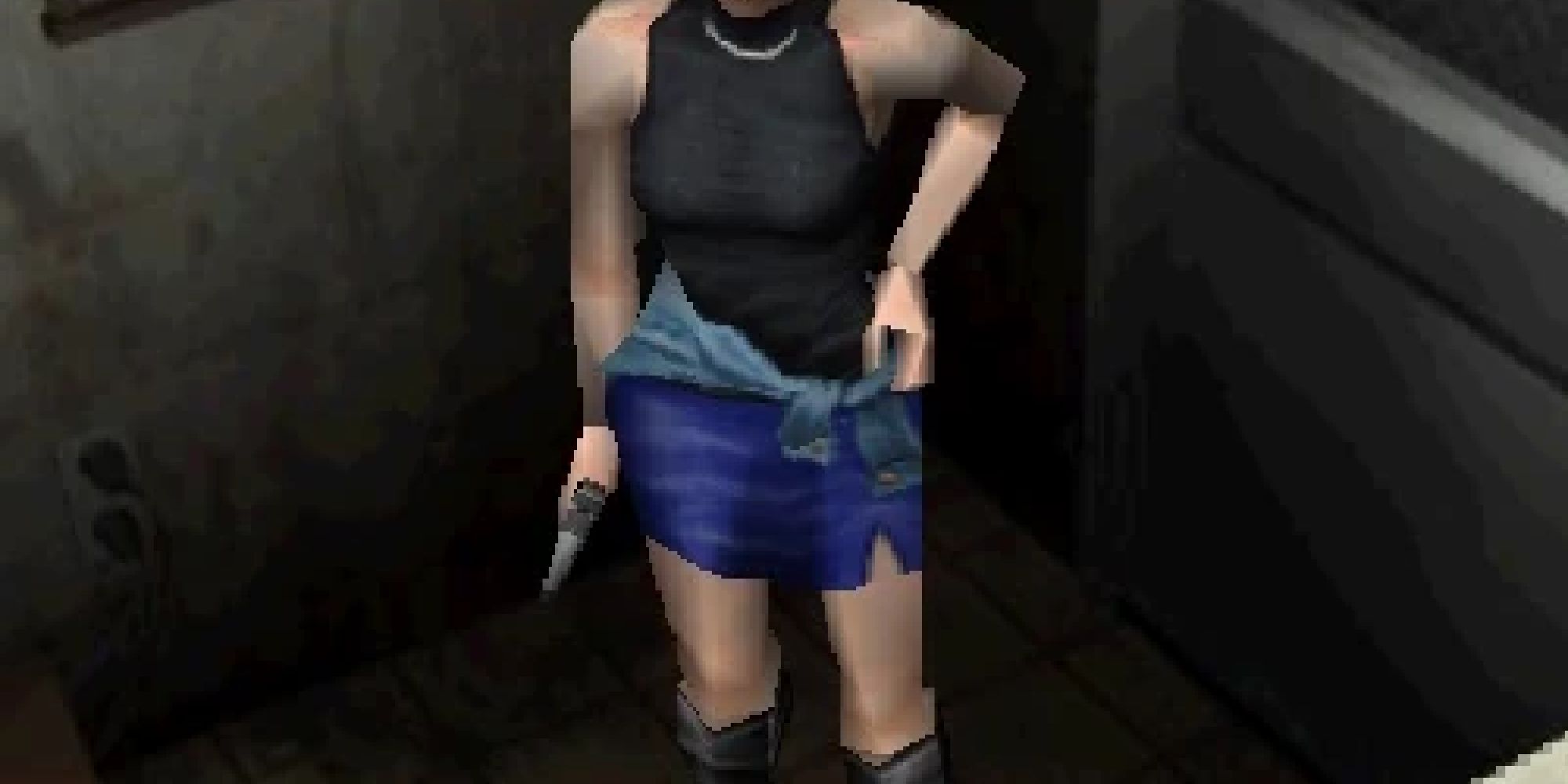 Jill standing with a hand on her hip in more casual attire. 
