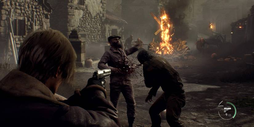 Image from the remake of Resident Evil 4 showing Leon Kennedy shooting some Ganados during the village section.