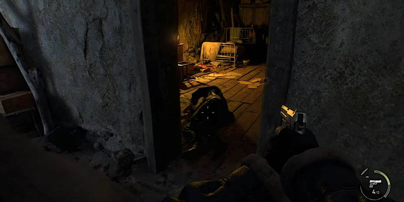 Image from the Resident Evil 4 remake demo showing a Ganados on the floor.
