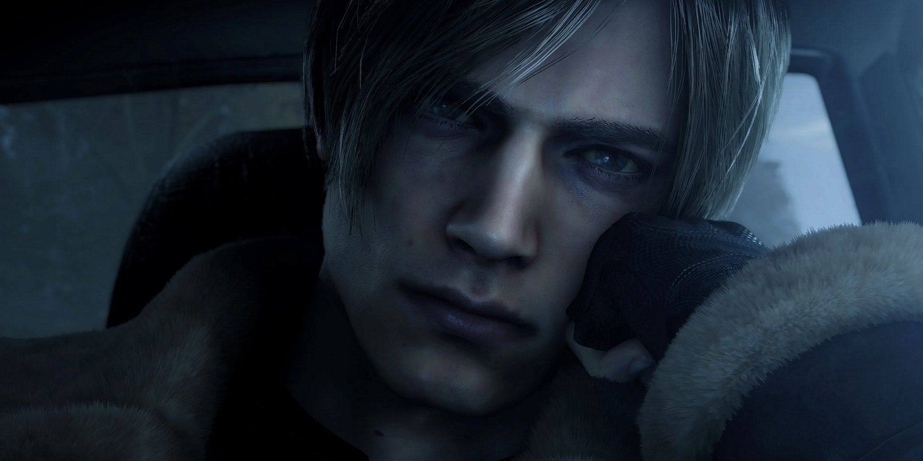 Screenshot from the Resident Evil 4 remake showing a close-up of a borrding Leon Kennedy.