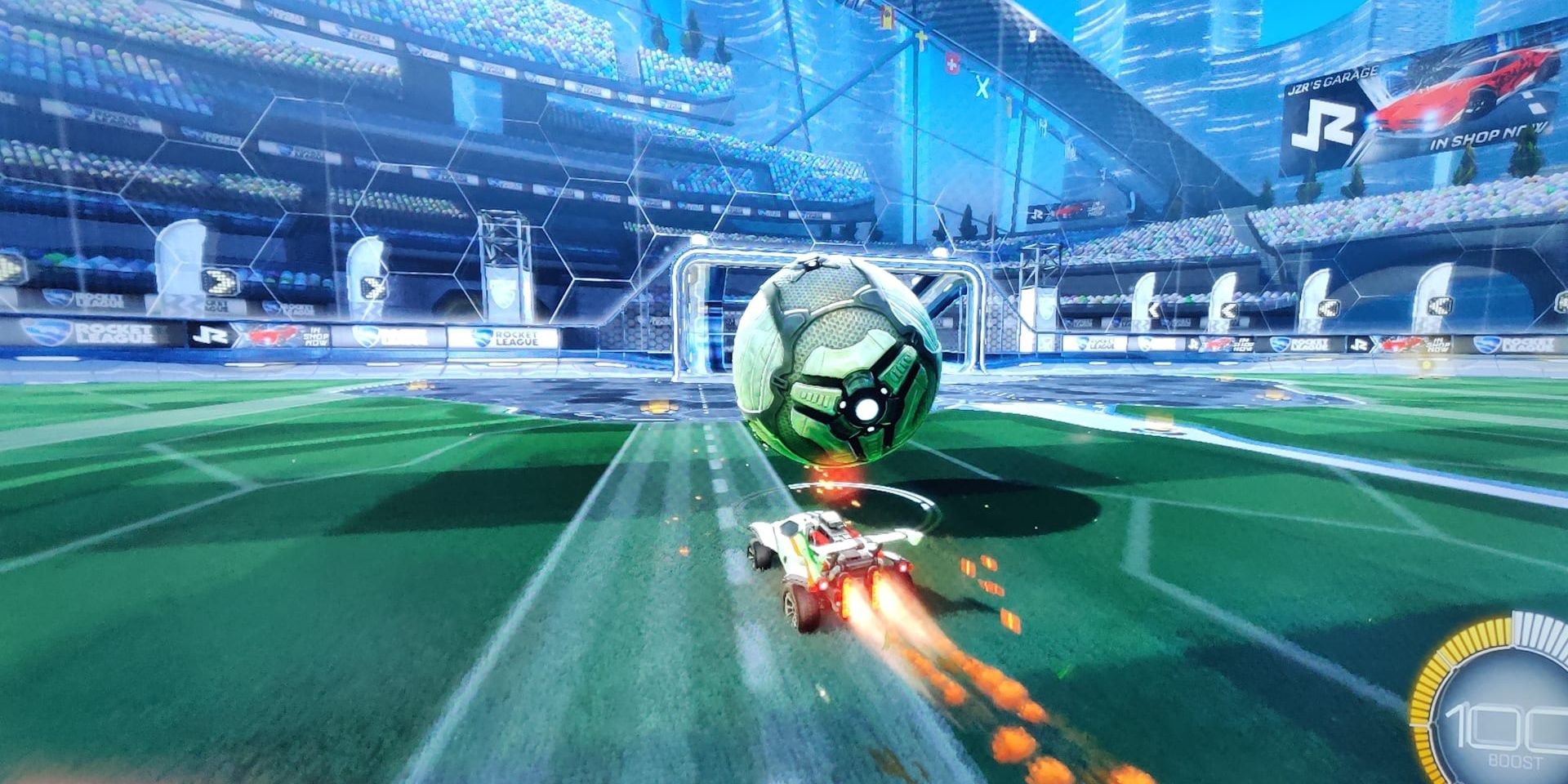 Rocket League Car Boosting With Ball Towards Goal