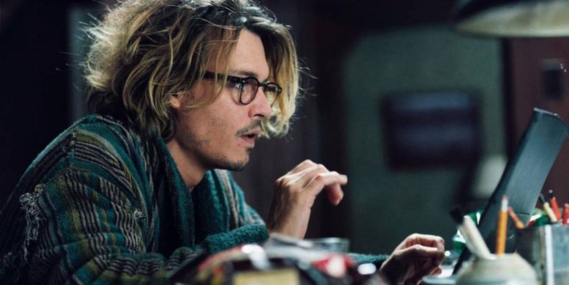 Johnny Depp as Mort writing in Secret Window
