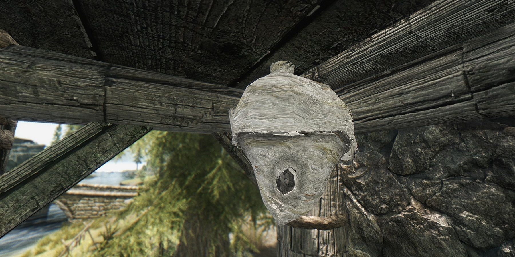 Image from Skyrim showing a mid shot of a beehive.