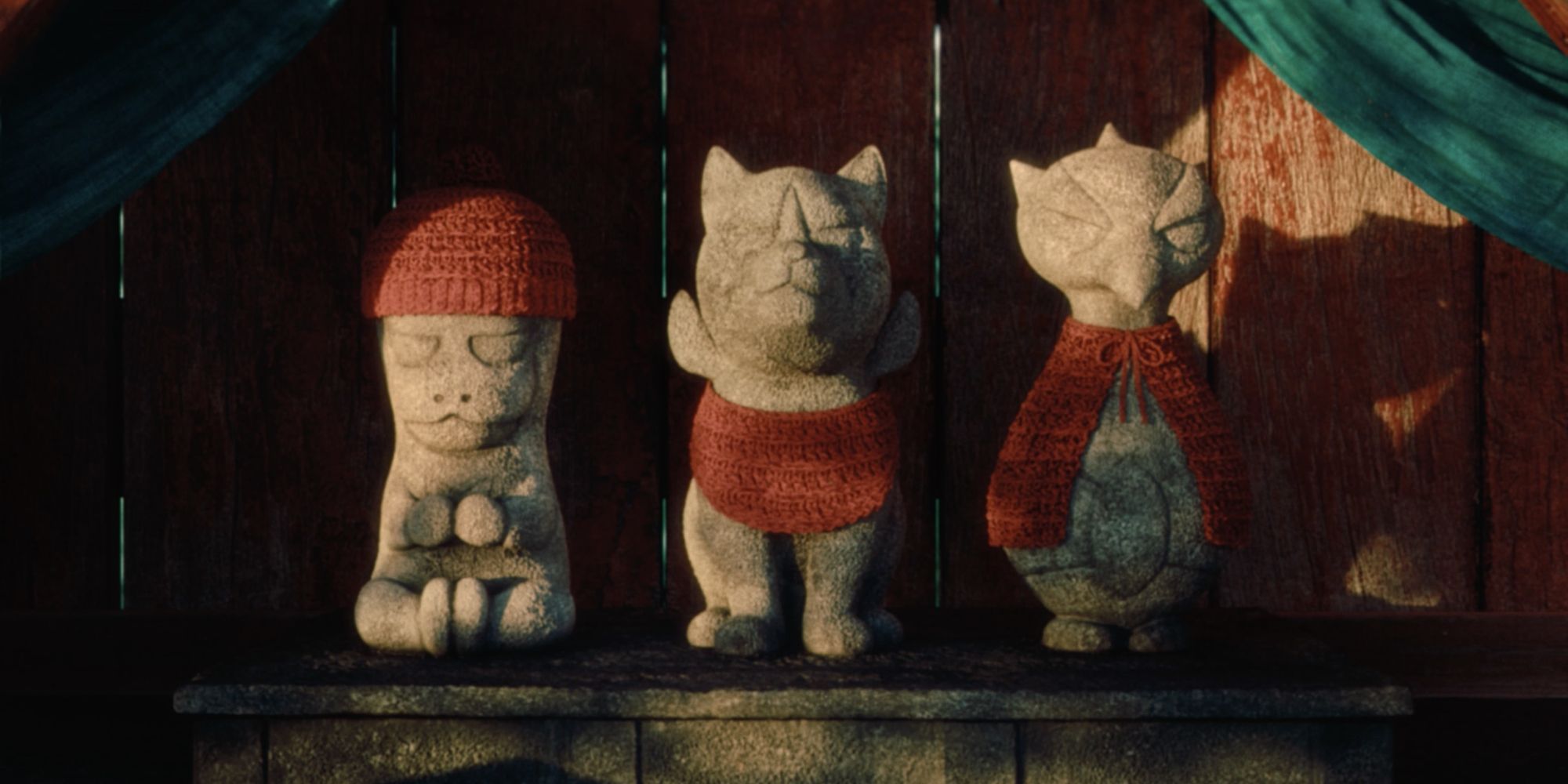 Statues of Okidogi, Munkidori, and Fezandipiti in a Scarlet/Violet trailer