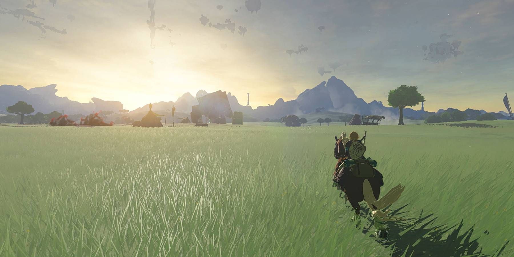 Link riding a horse into the sunset in Tears of the Kingdom