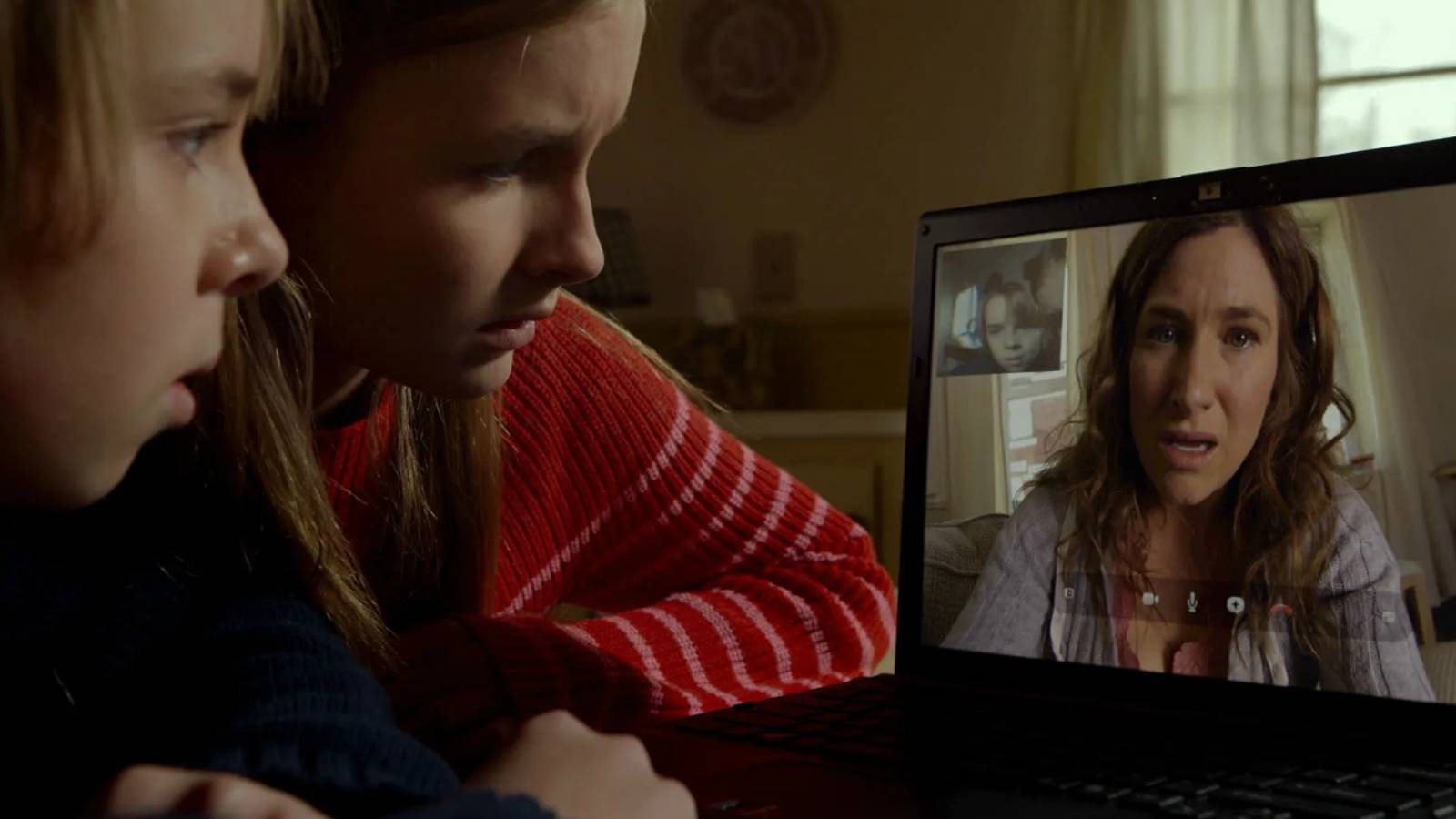 Becca and Ed talking to Loretta on their computer in The Visit
