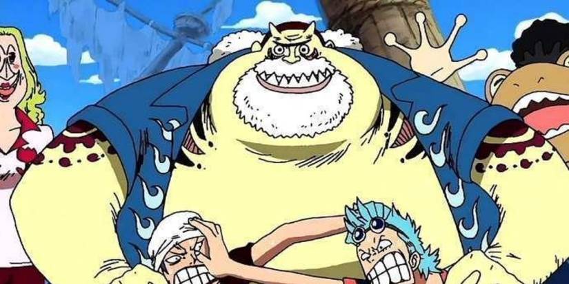 Tom holding his kids