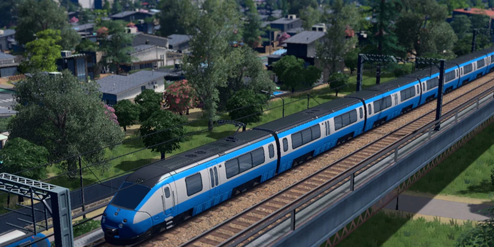Blue Train Cities Skylines on rails with houses in the background 