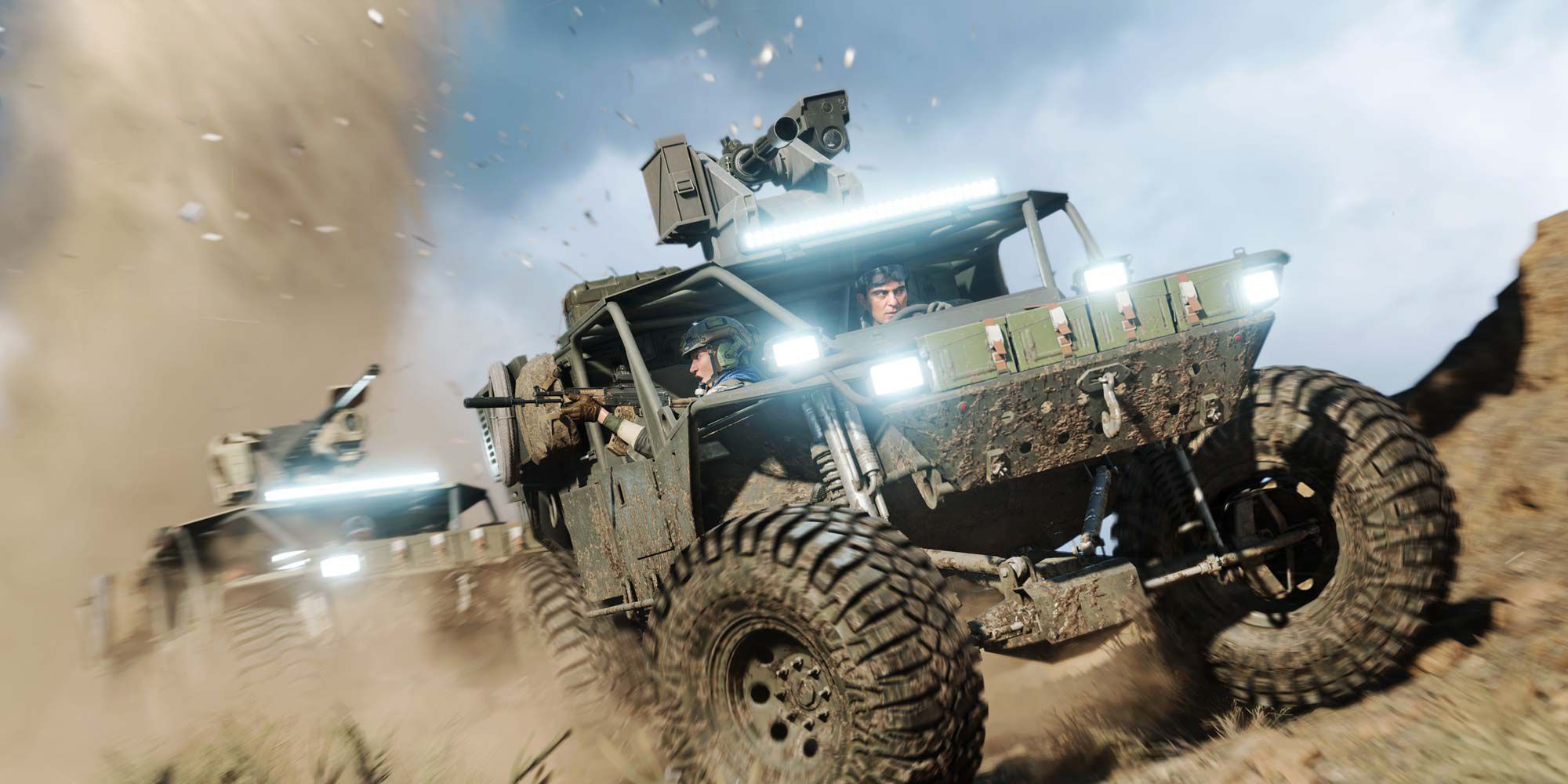 Battlefield 2042 army trucks driving in single file in the dirt. Both have guns mounted on the roof