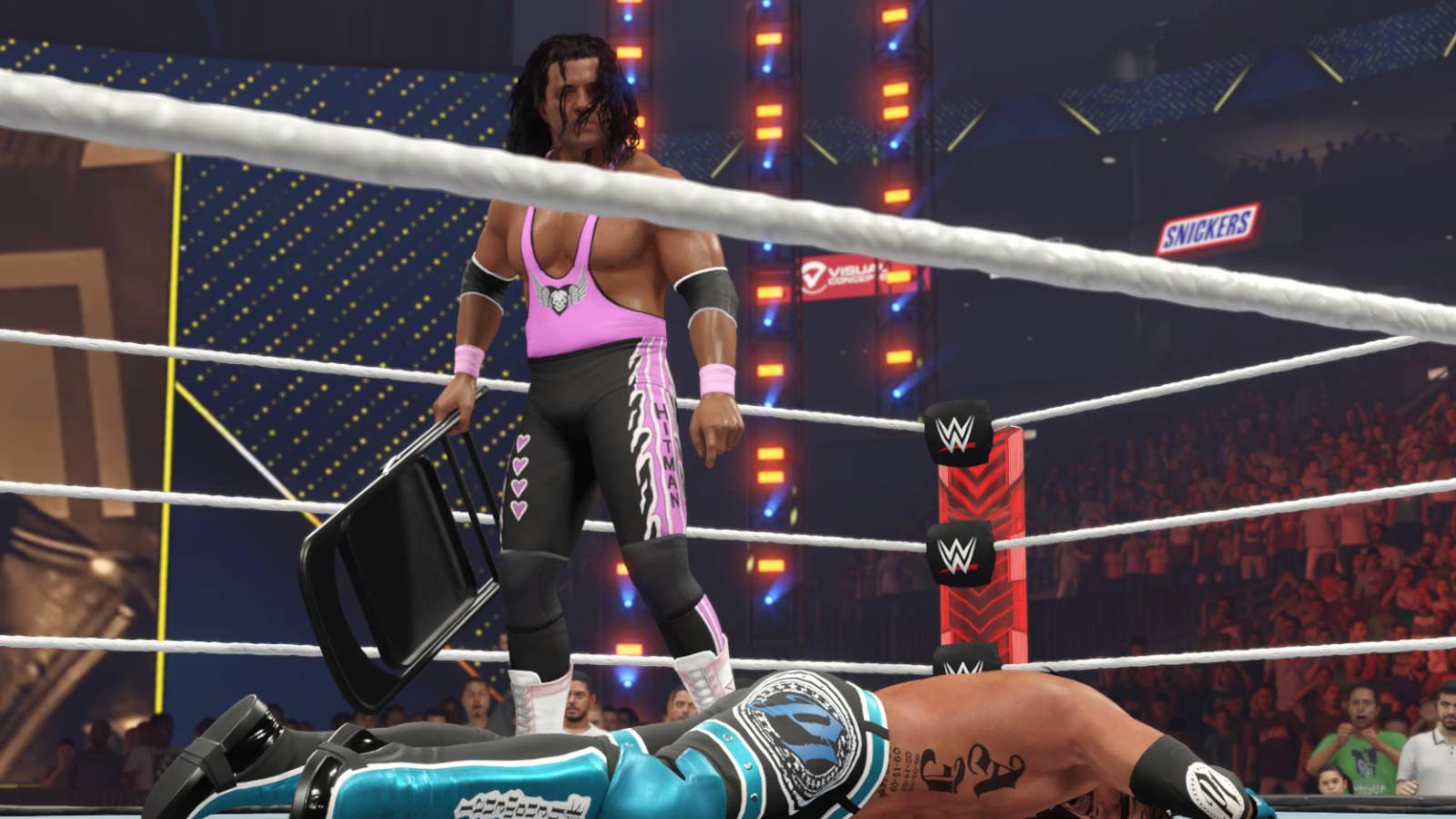 WWE 2K23 Bret Hart attacking AJ with a chair
