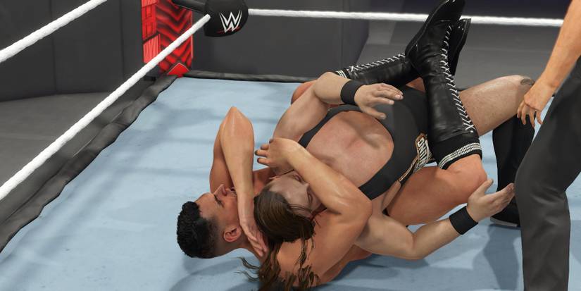 WWE 2K23 Gunther with a submission move on Butch
