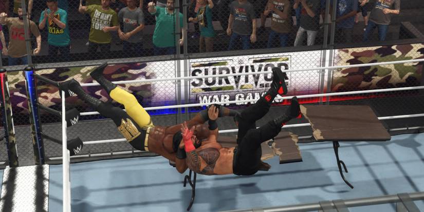 WWE 2K23 Lashley putting Roman through the table in the WarGames rules