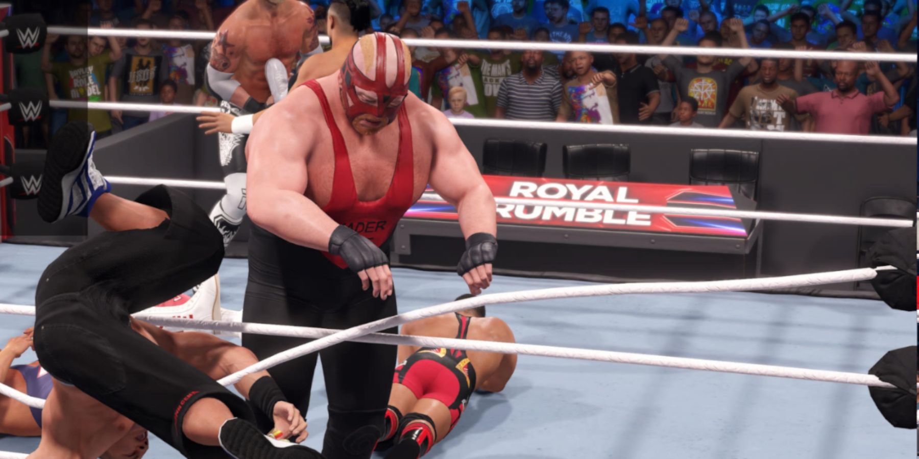 WWE2K23 Vader clotheslining John Cena over the top rope