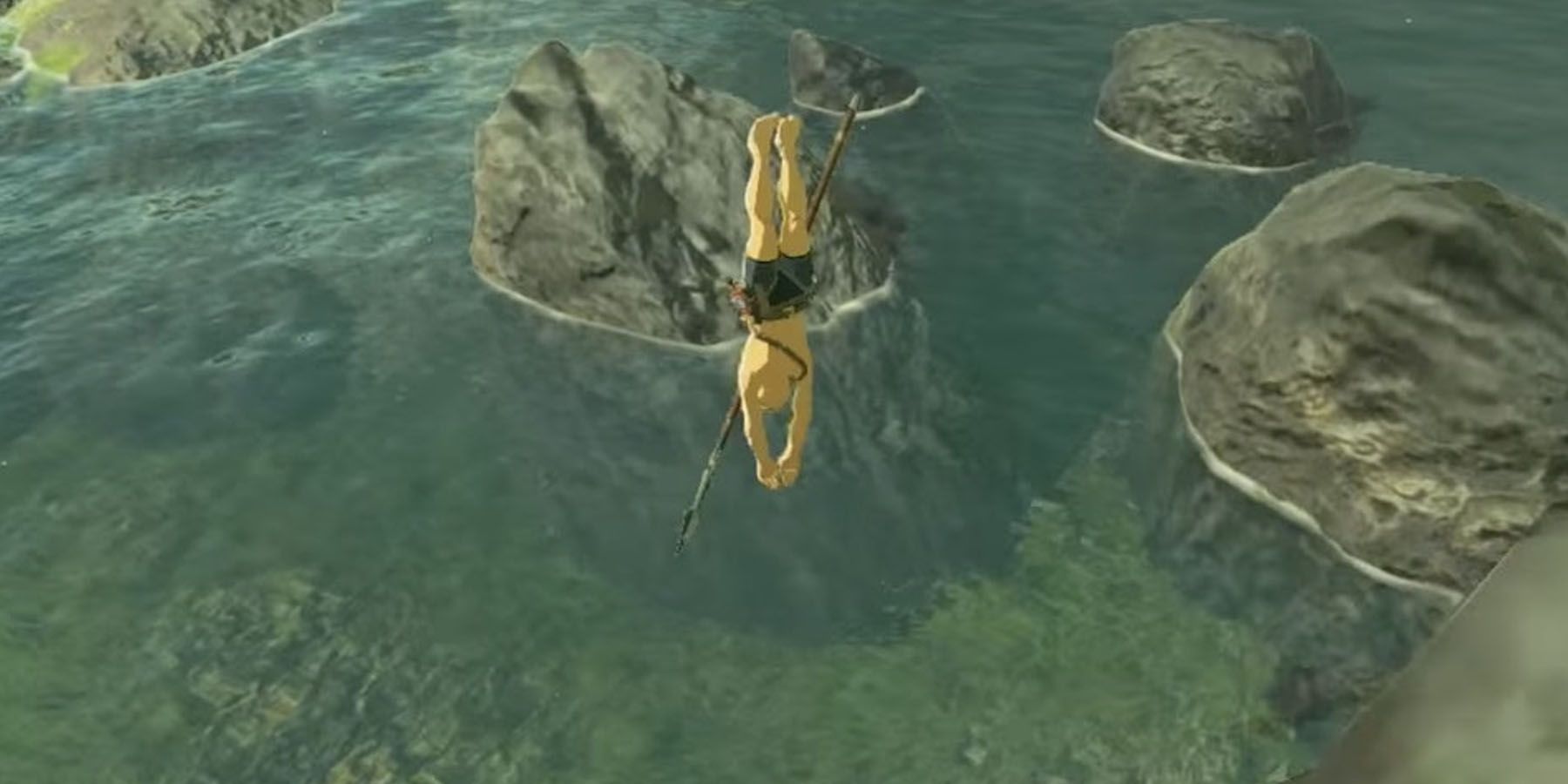 A screenshot of Link jumping off a cliff in The Legend of Zelda: Breath of the Wild.