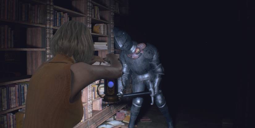 Ashley shines a lantern at an Armadura in Resident Evil 4 remake