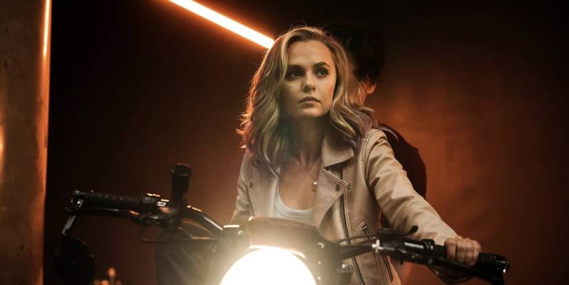 Madison Iseman as Sienna Athena in Knights of the Zodiac riding motorcycle