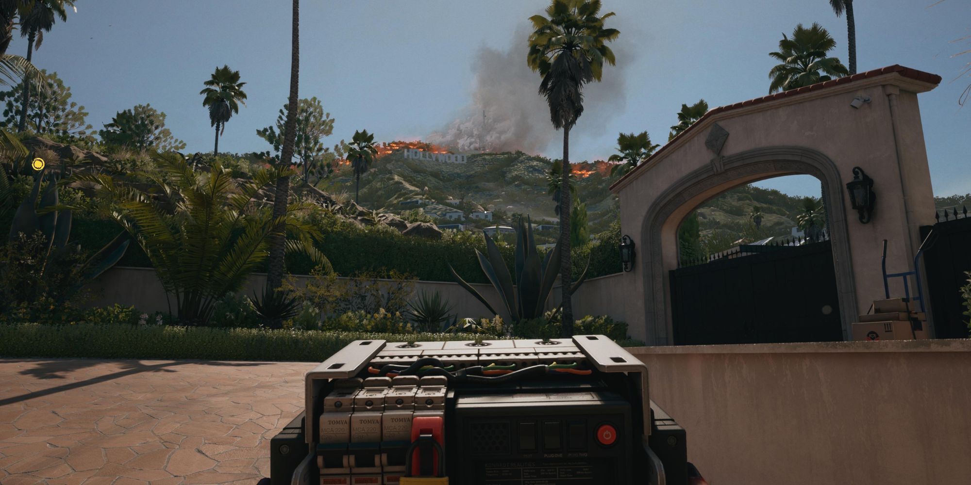 A player holding a breaker while looking at the Hollywood sign in Dead Island 2