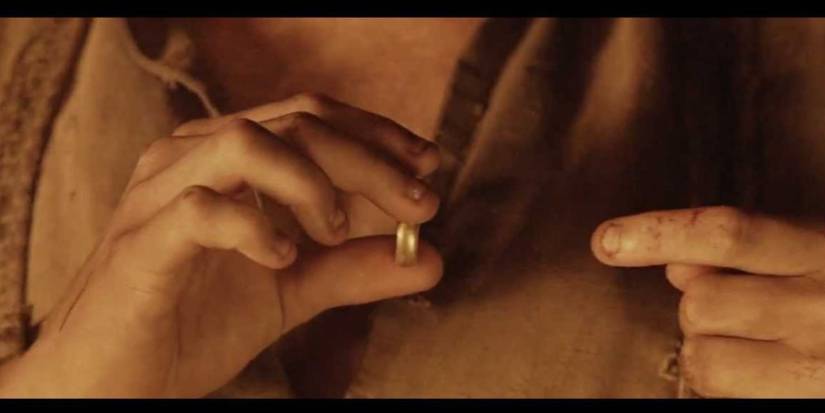 Frodo puts on the ring