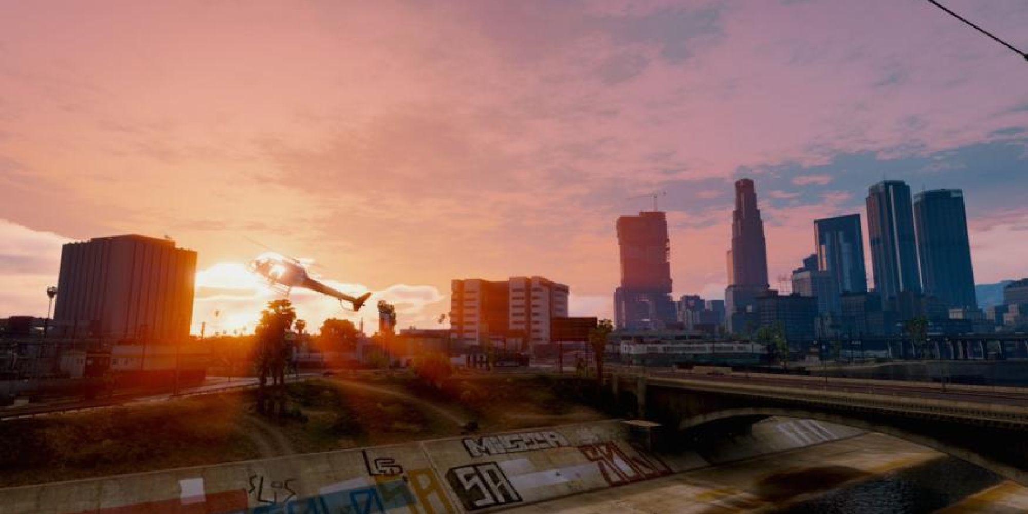 A scene of a helicopter taking off as the sun sets in the background of Grand Theft Auto 5