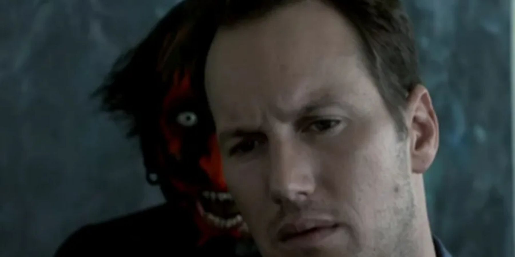 Patrick Wilson with The Red-Faced Demon behind him in Insidious