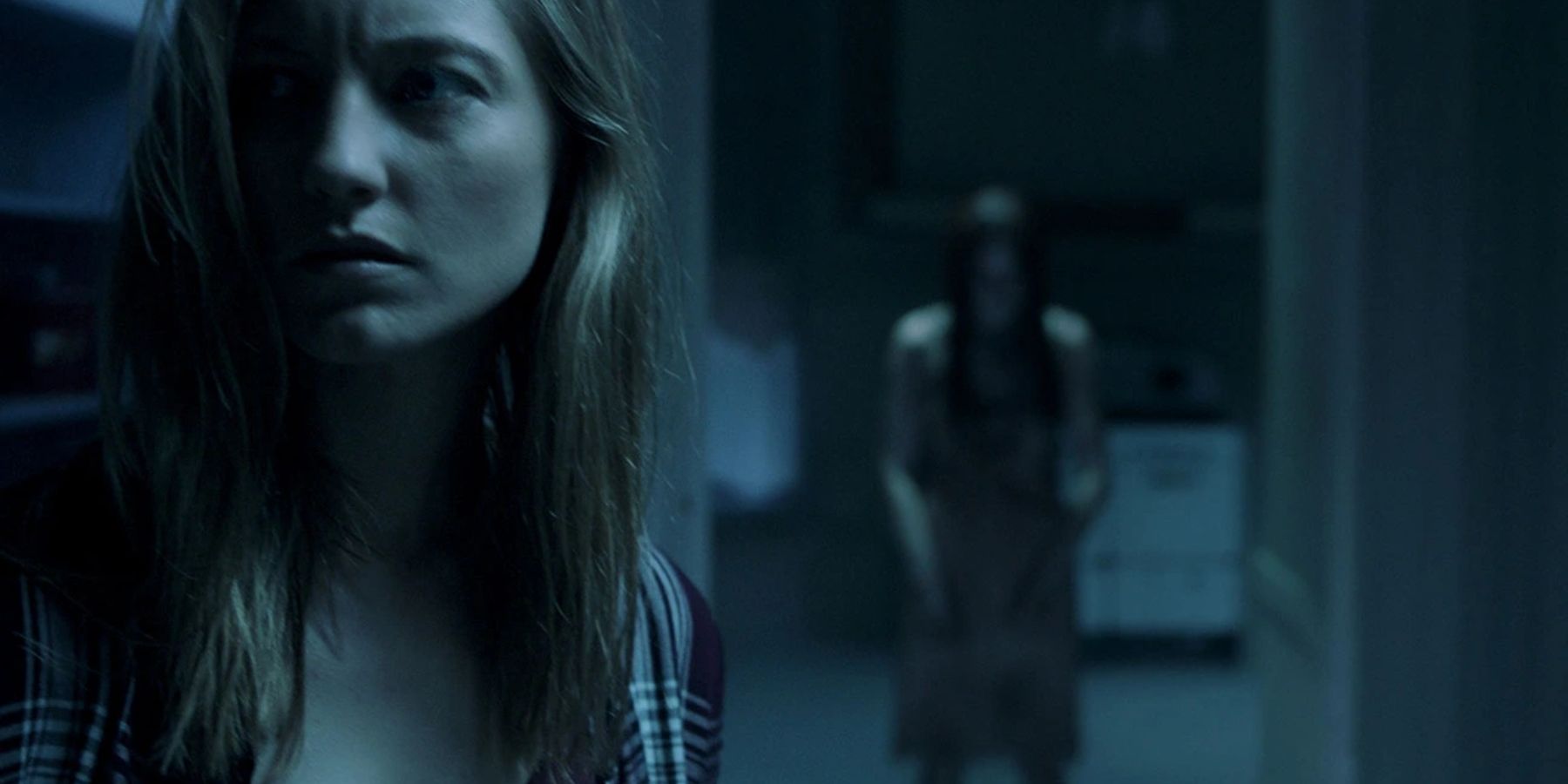 Melissa Rainer in Insidious: The Last Key with a demon behind her
