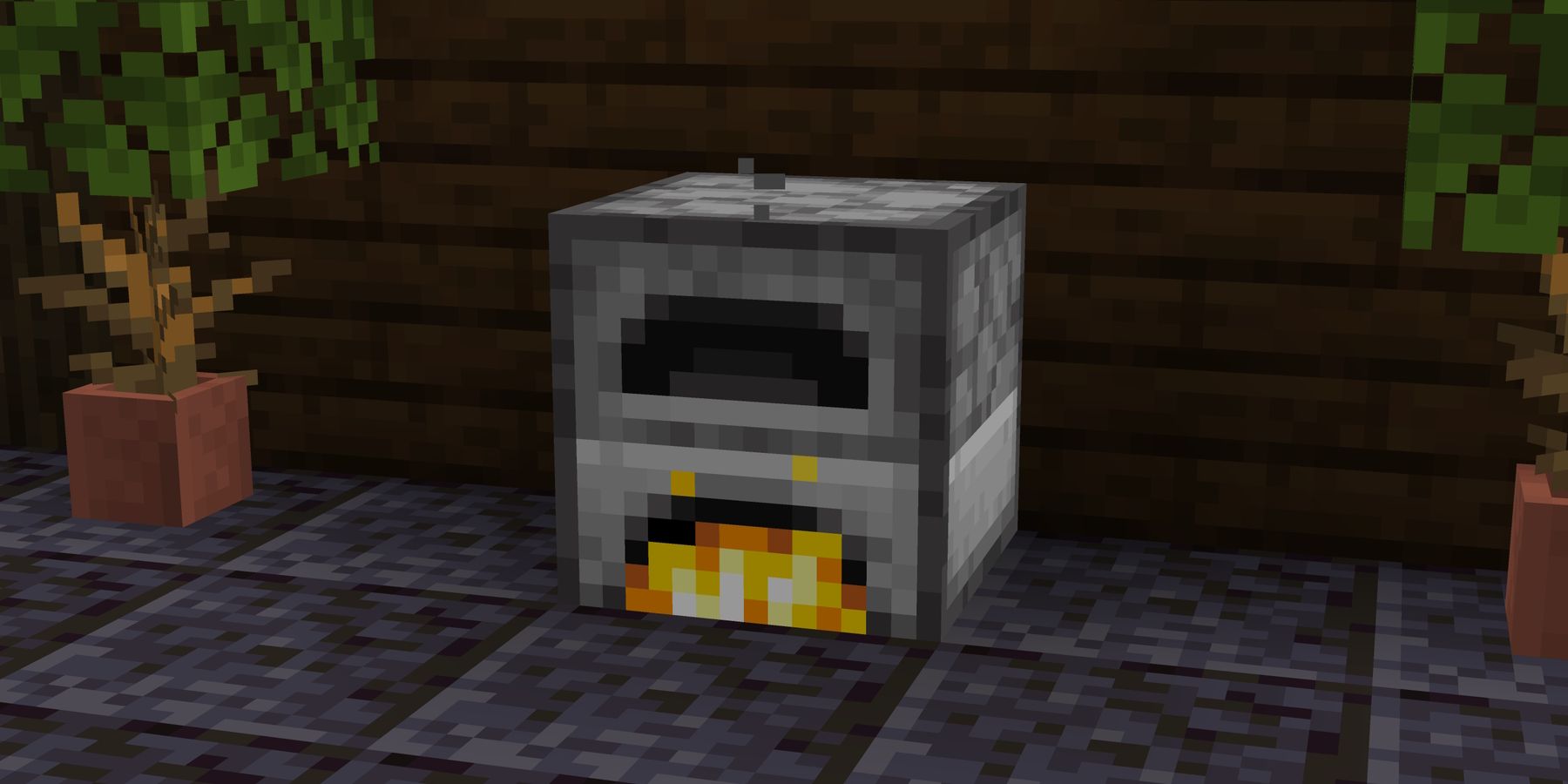 Screenshot of a furnace from Minecraft near potted plants